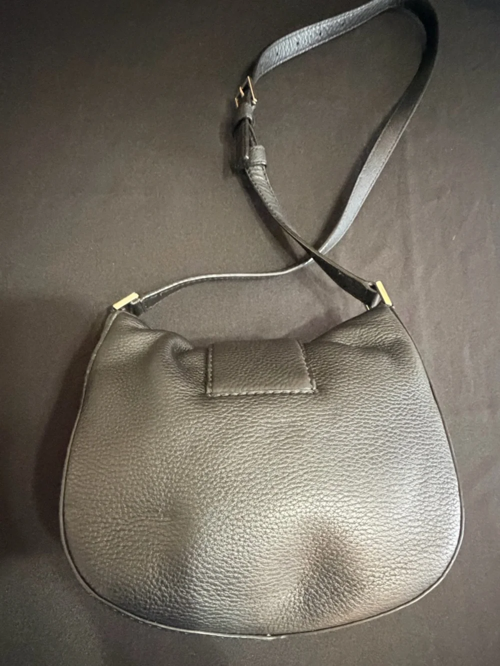 Kate Spade Black Saddle Bag Like New Condition. Very stylish and comfortable.